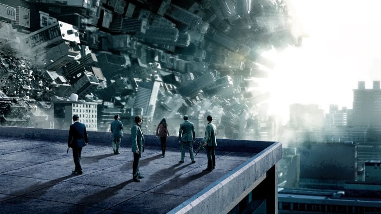 Imagen publicitaria de Inception, el elenco de espaldas, en un edificio, observando lo que puede suceder en un sueño.