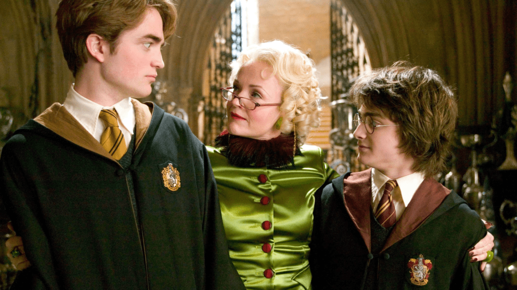 Cedric Diggory, Rita Skeeter y Harry Potter en una escena de El Cáliz de Fuego (2005)